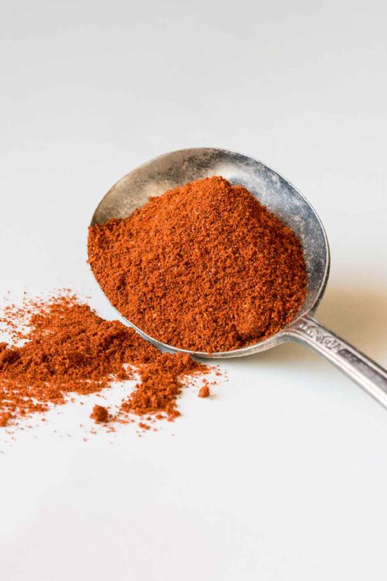 A spoonful of dried chile powder.