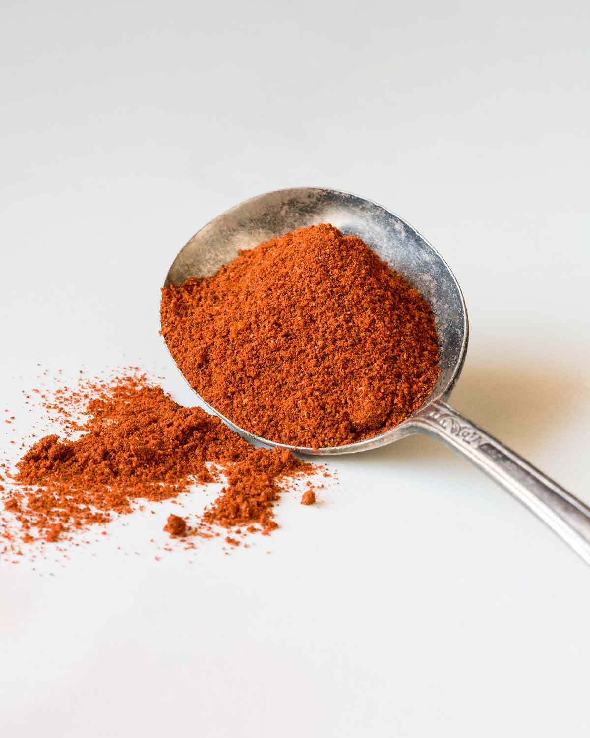A spoonful of dried chile powder.