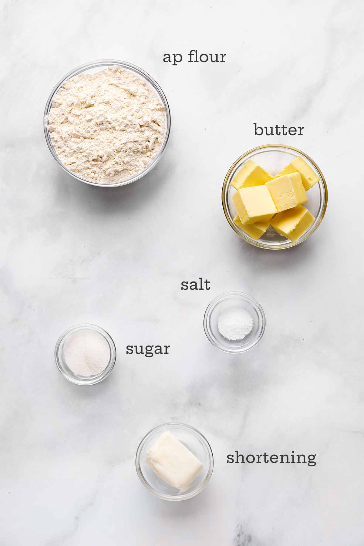 Ingredients for food processor pie crust--flour, butter, salt, sugar, and shortening.