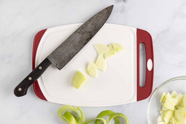 Slices of apple on a cutting board.