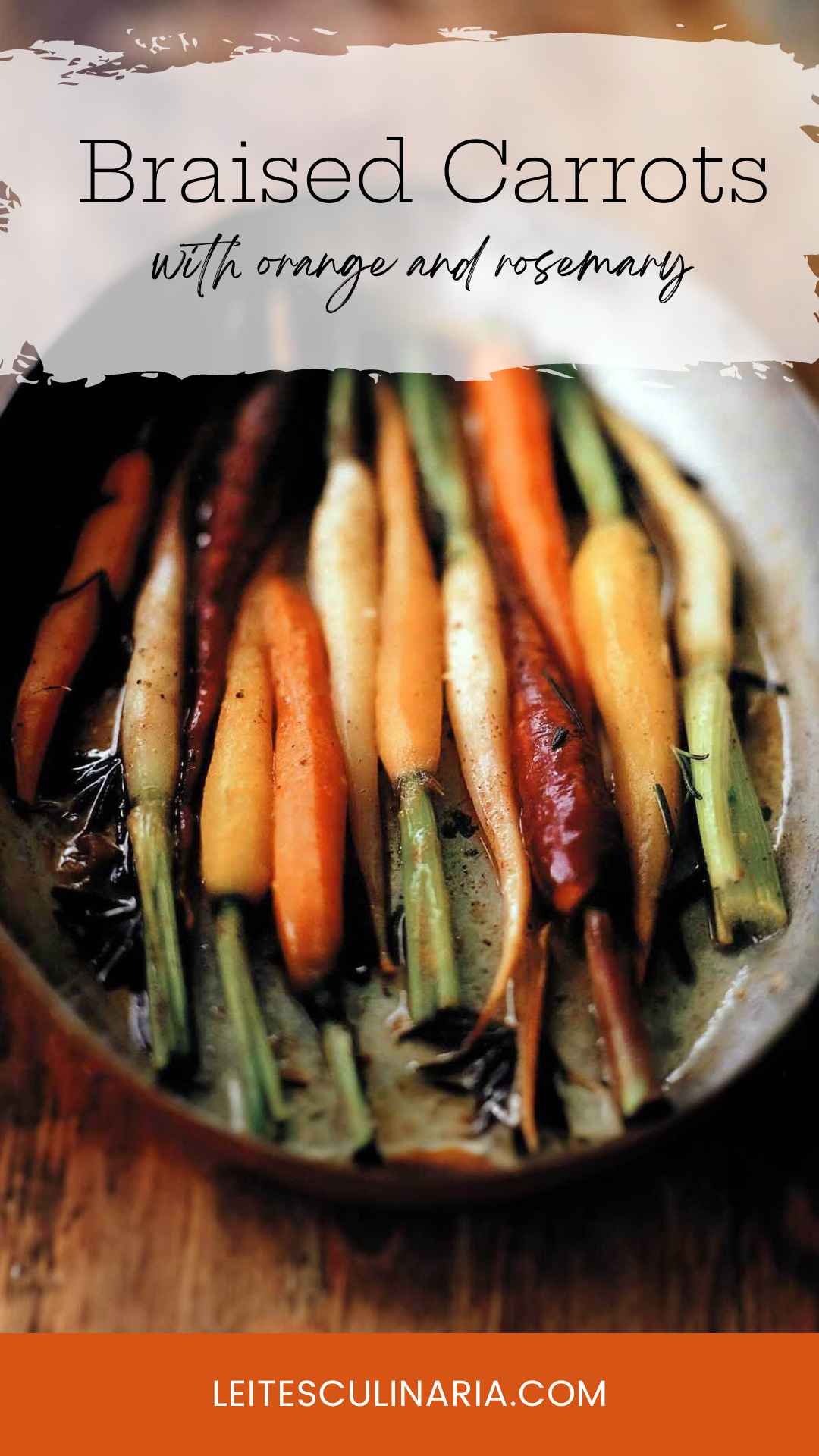 An oval dish with a dozen multi-colored carrots in braising liquid.