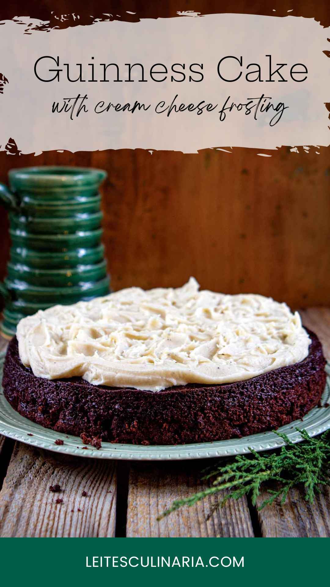 A chocolate cake topped with cream cheese frosting on a green plate.