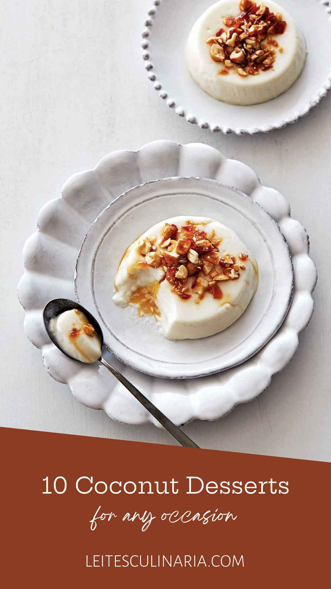 A coconut panna cotta topped with peanut brittle crunch on a white plate.