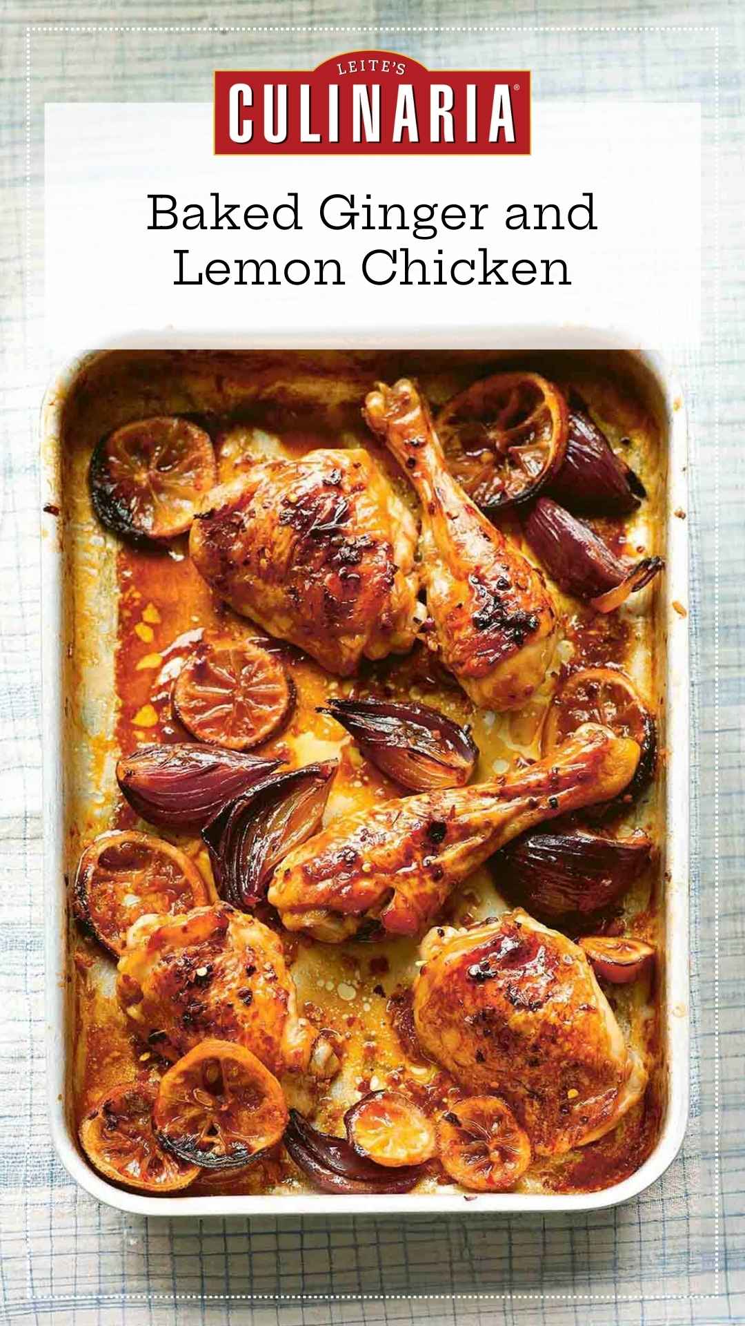 Baked chicken pieces in a baking dish with red onion wedges and lemon slices.