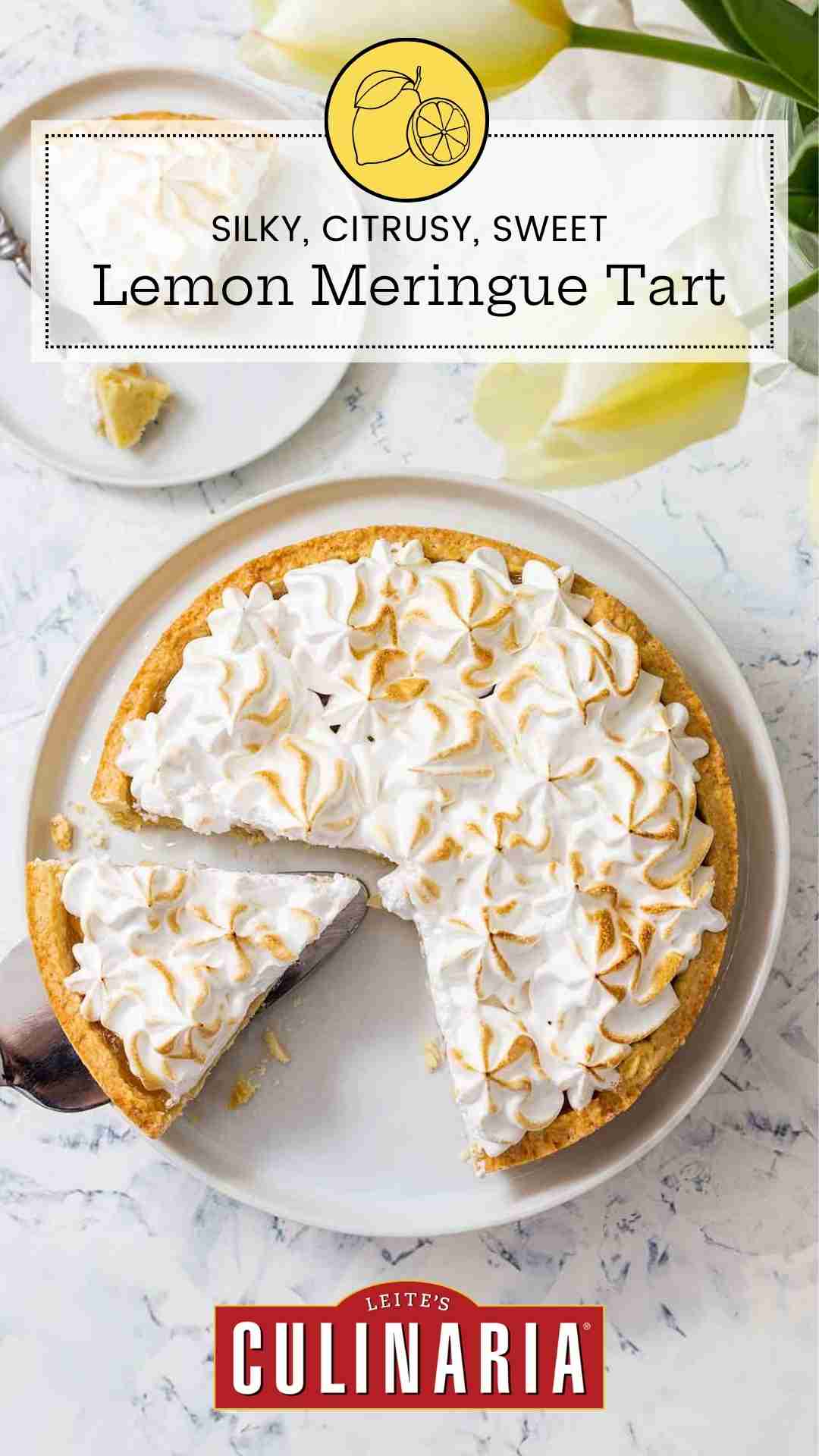 A lemon meringue tart in a white dish, with one slice on a plate beside it and one more being lifted out.