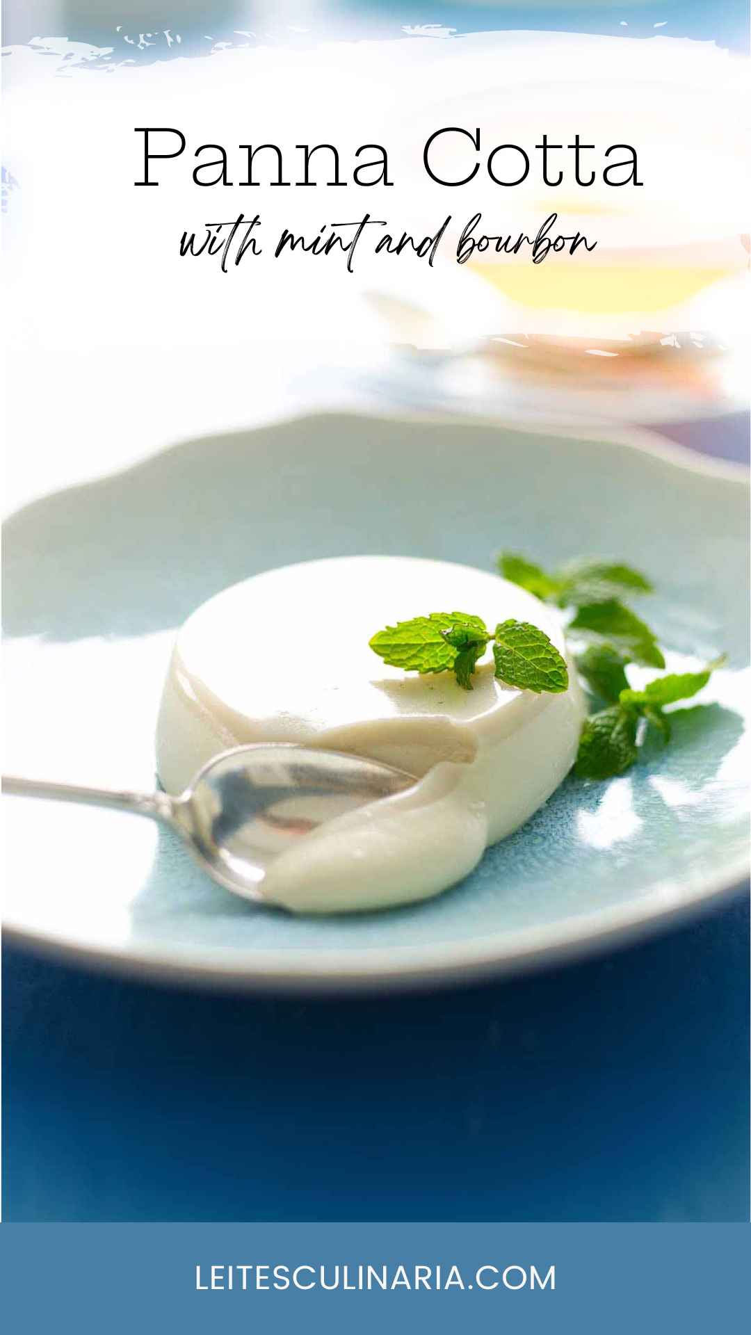 A serving of mint julep panna cotta in a blue bowl, garnished with mint leaves.