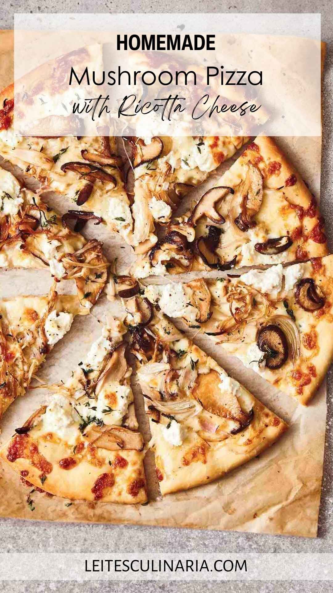 A whole mushroom pizza with ricotta sliced into eight pieces on a sheet of parchment paper.