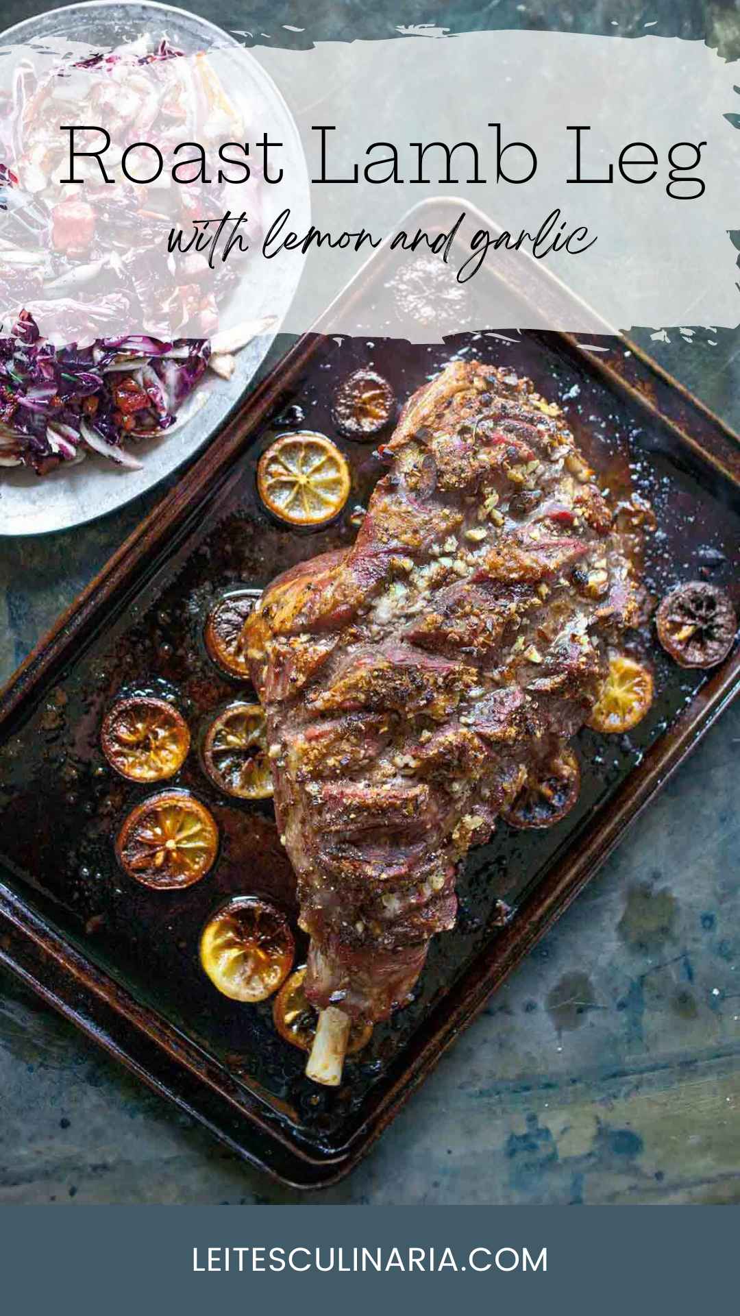 A whole roast leg of lam on a rimmed baking sheet with charred lemon slices scattered around it.