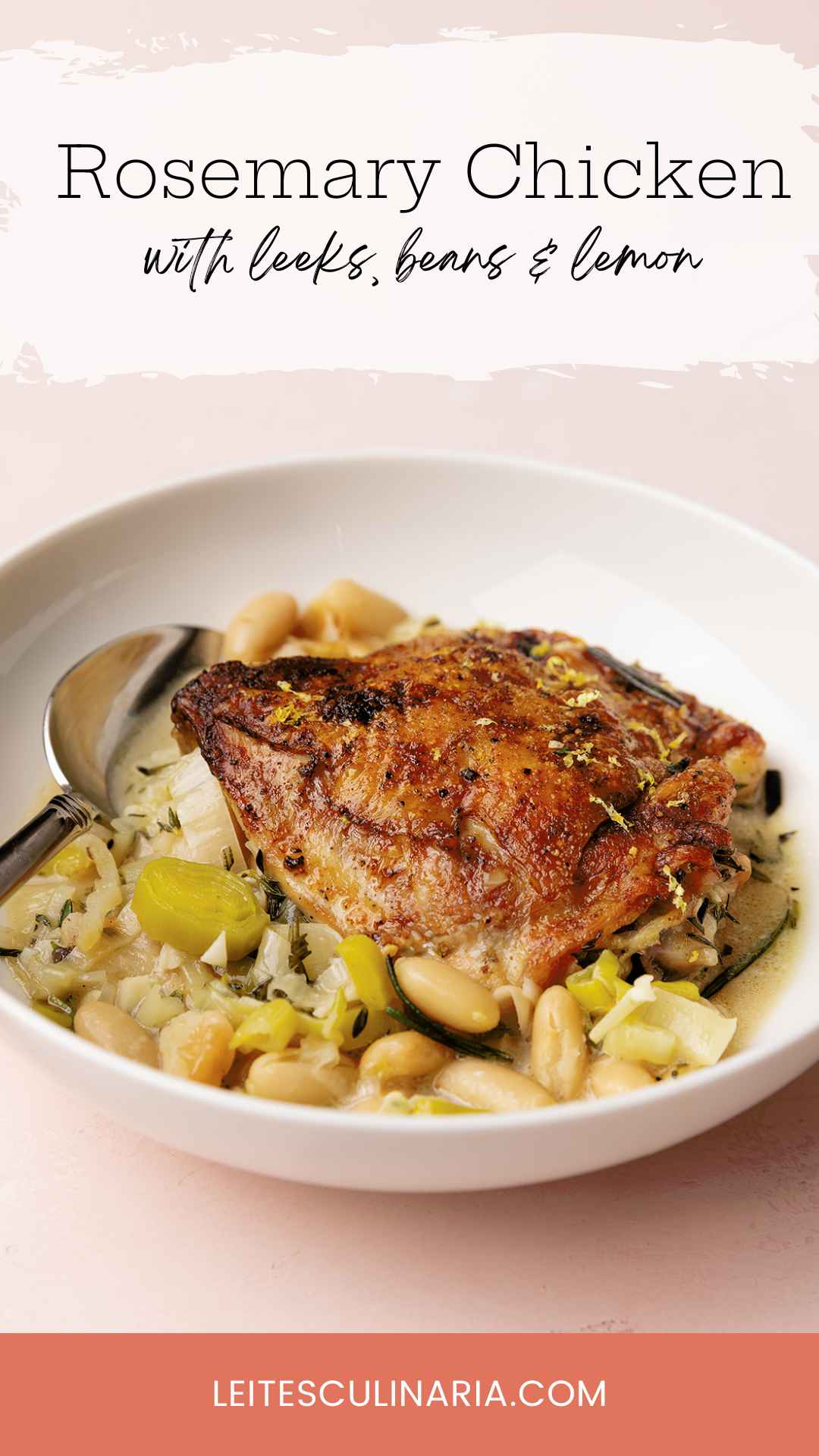 A bowl with one crispy chicken thigh on top of a mixture of leeks and cannellini beans.