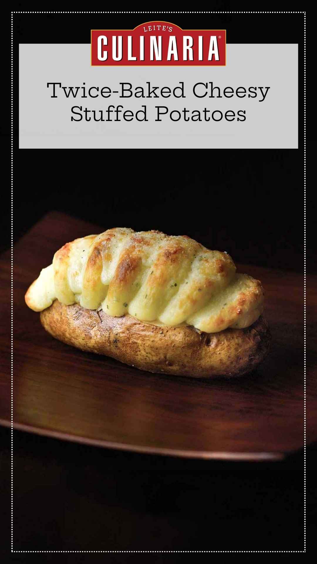A baked potato stuffed with mashed potato and cheddar stuffing piped into it.