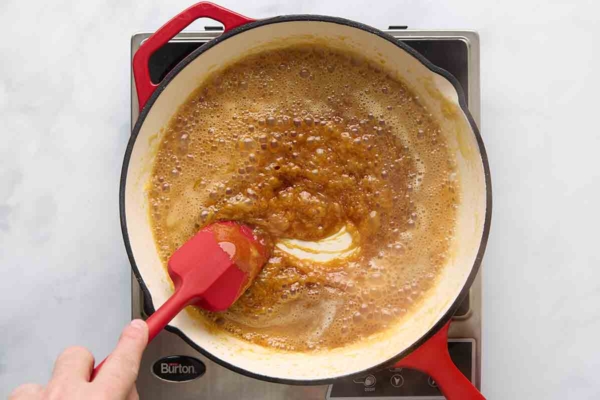 Caramel sauce bubbling in the skillet.