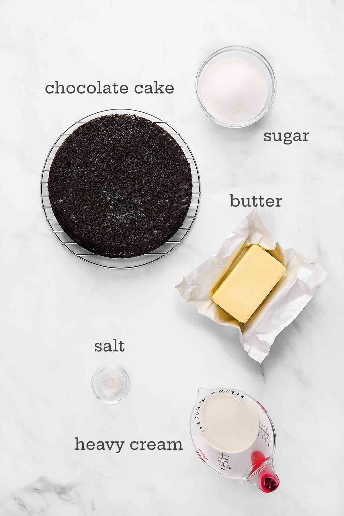 Ingredients for chocolate caramel cake--chocolate cake, sugar, butter, salt, and heavy cream.