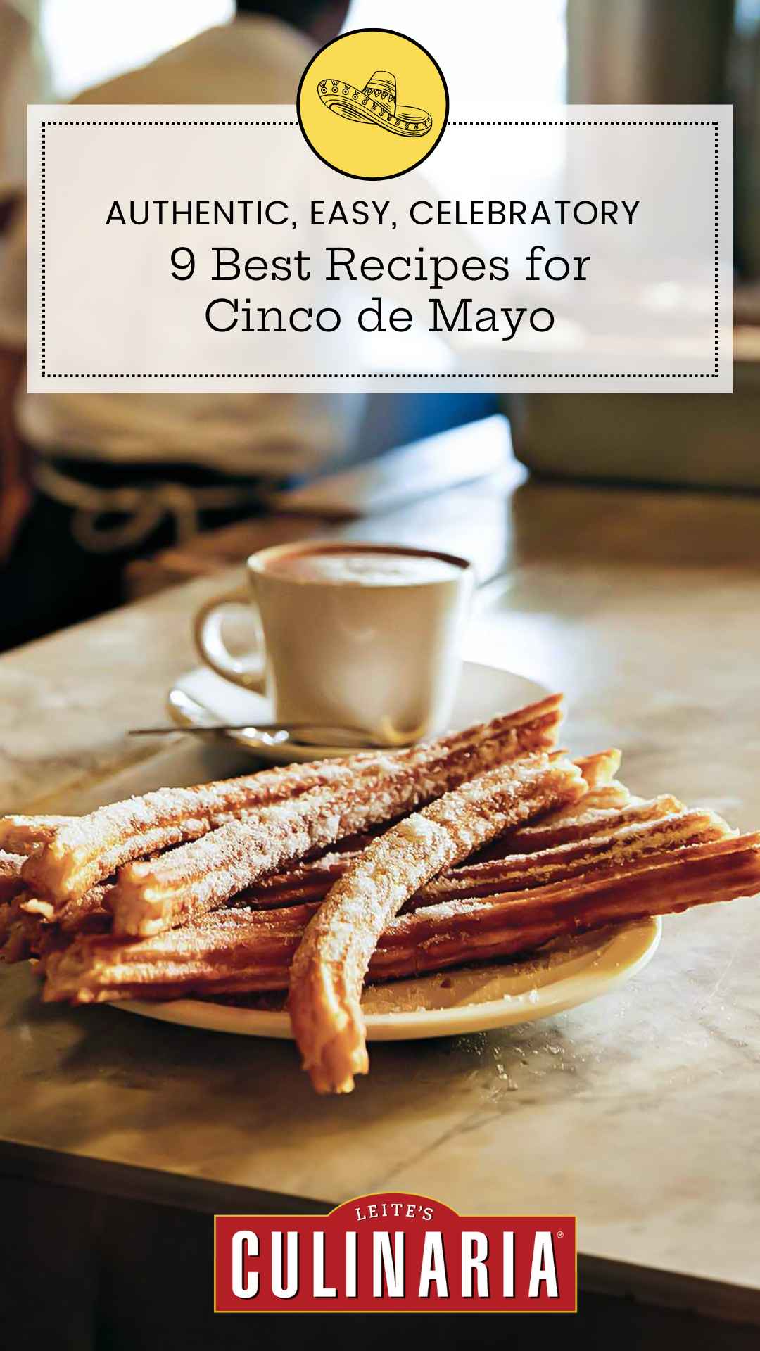 A plate of churros with a mug of hot chocolate in the background.