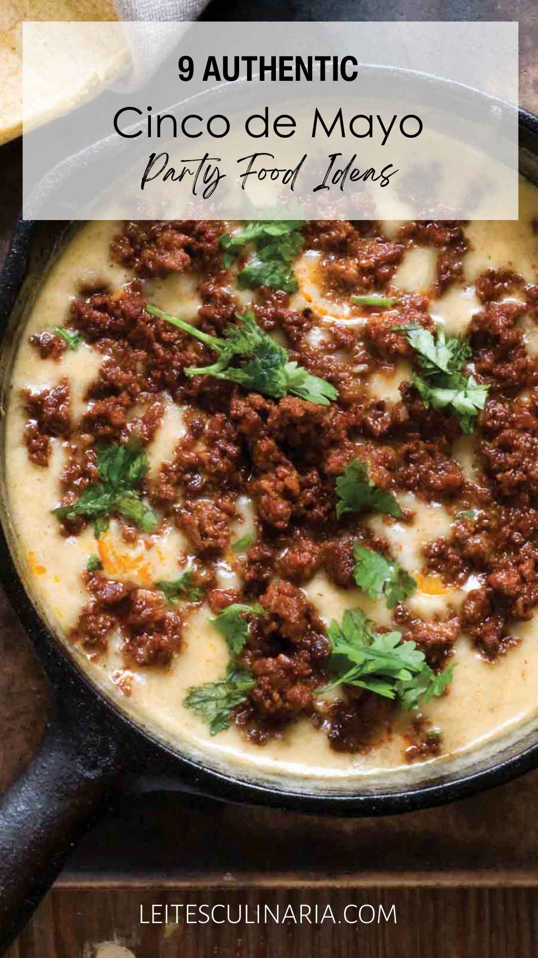 A skillet filled with queso, topped with crumbled chorizo and cilantro.