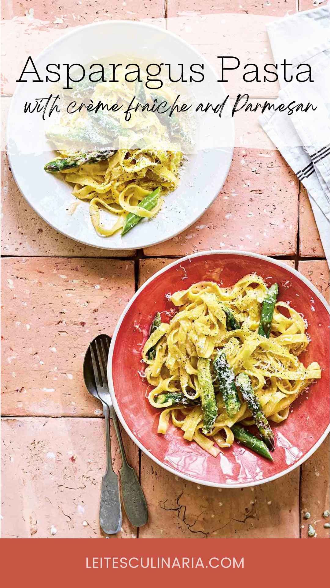 Two plates of creamy asparagus pasta topped with grated Parmesan cheese.