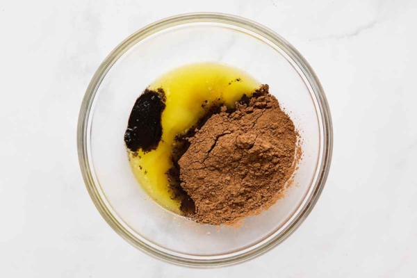Cocoa, melted butter, and espresso powder in a bowl.
