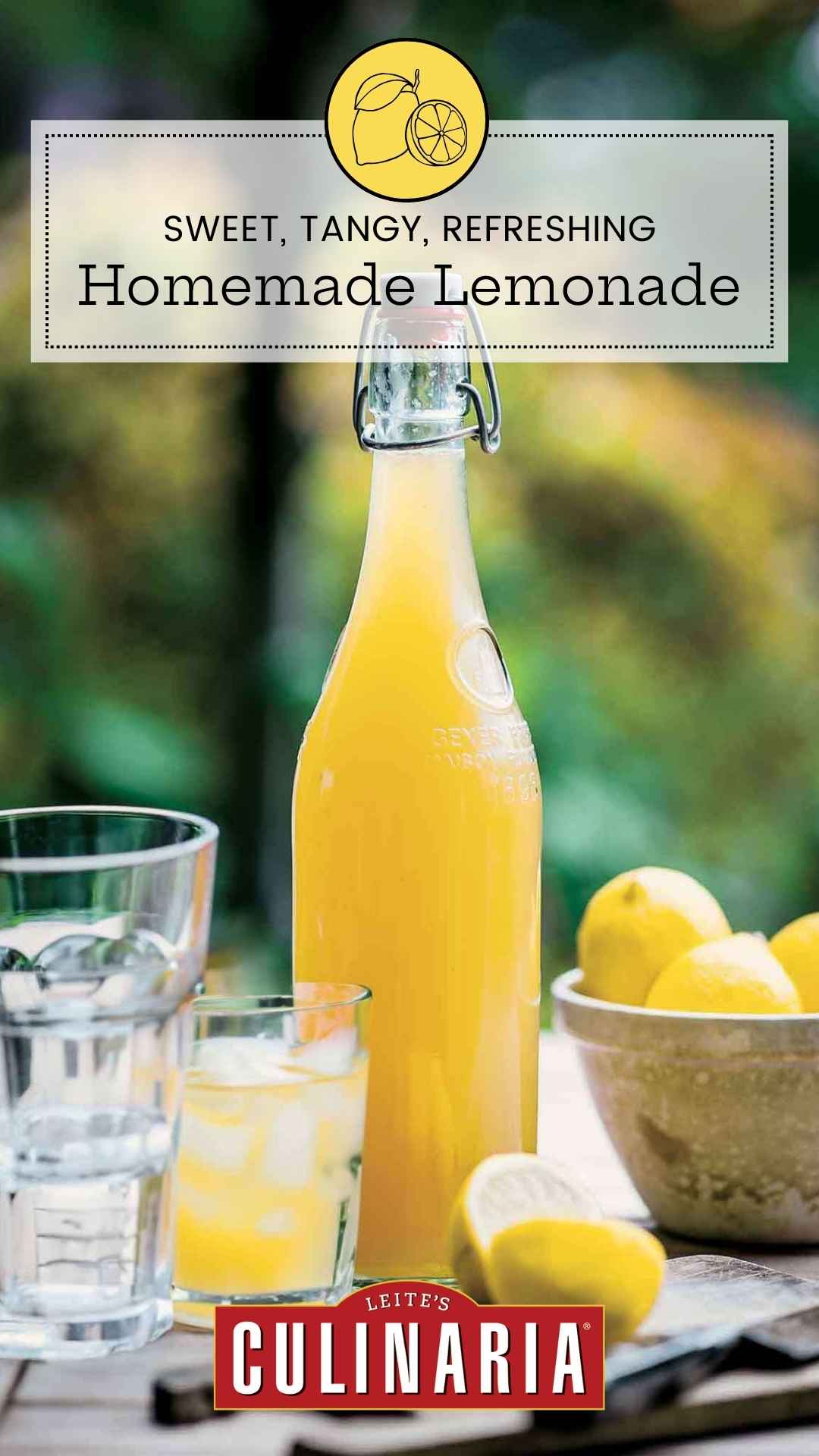 A bottle of lemon syrup with fresh lemons and a glass of lemonade nearby.