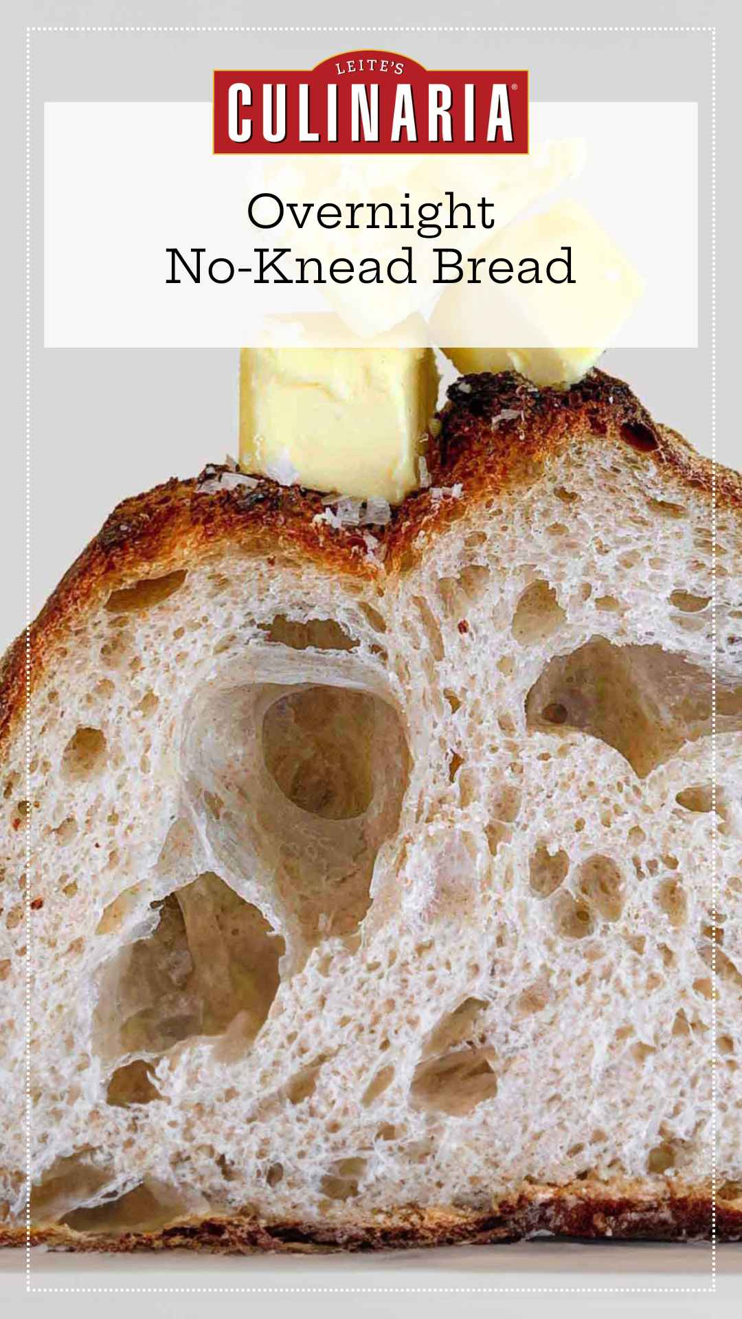 An interior view of a loaf of Jim Lahey's no-knead bread, topped with cubes of butter and flaked salt.