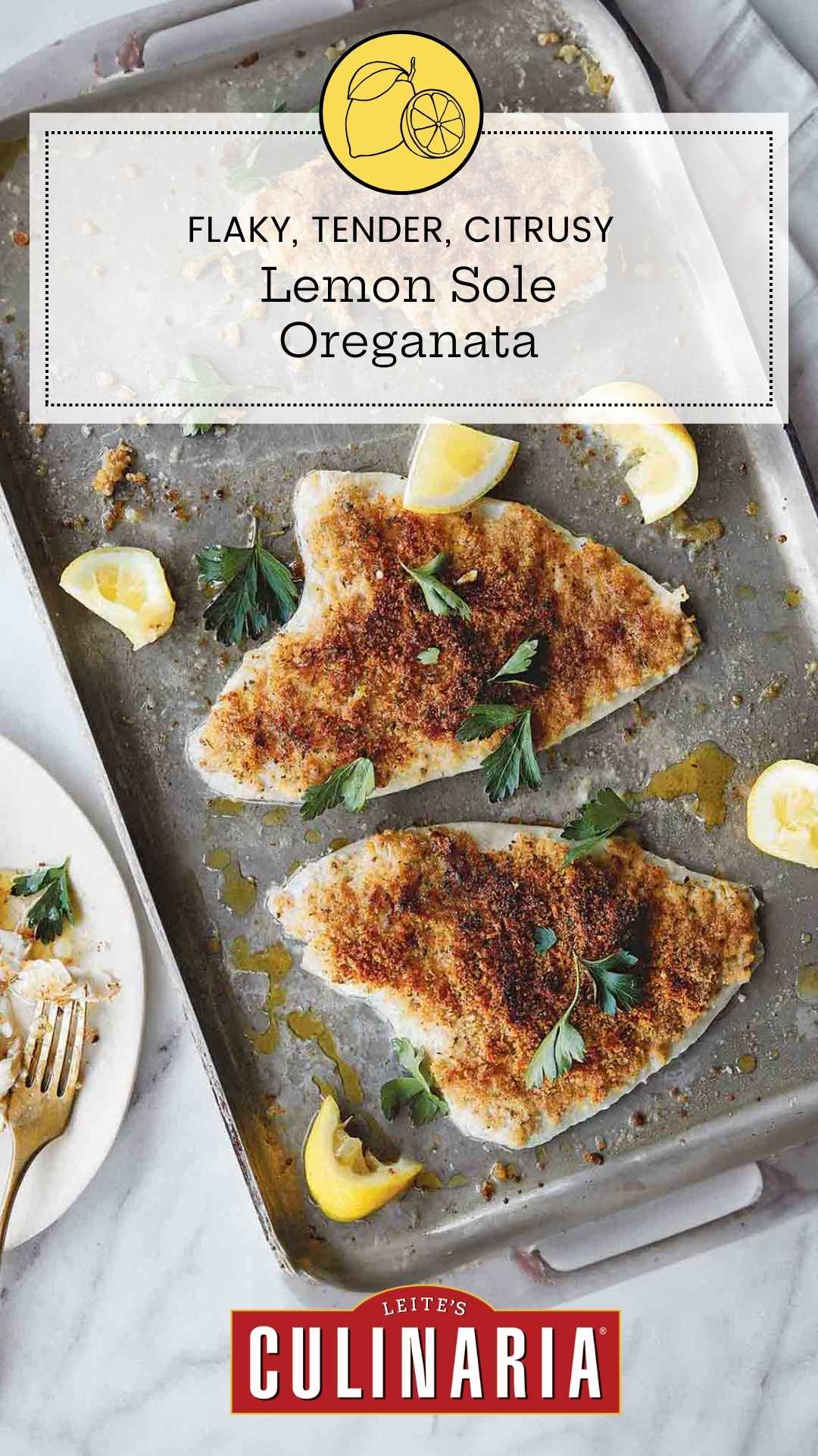 Three pieces of baked sole with bread crumbs and lemon on a rimmed baking sheet.