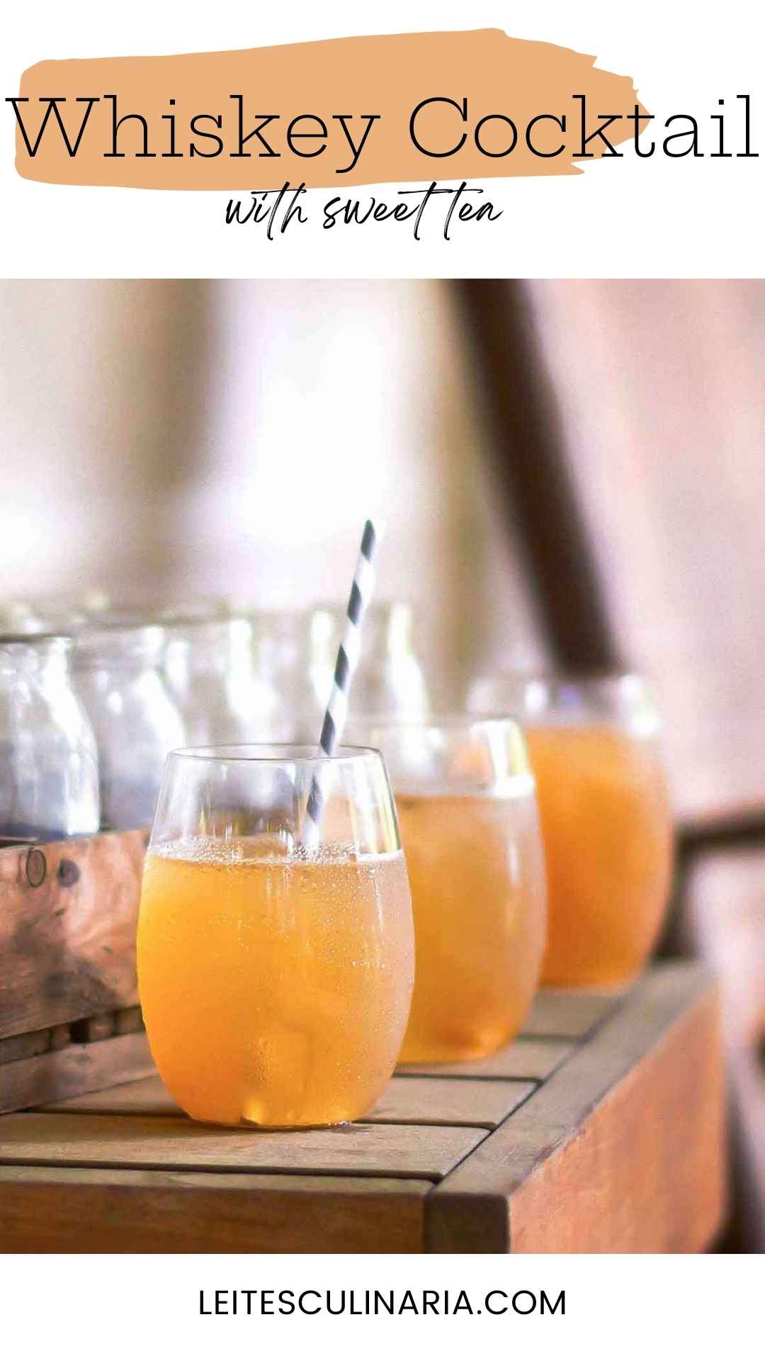Three glasses filled with sweet tea cocktail, with a straw sticking out of one glass.