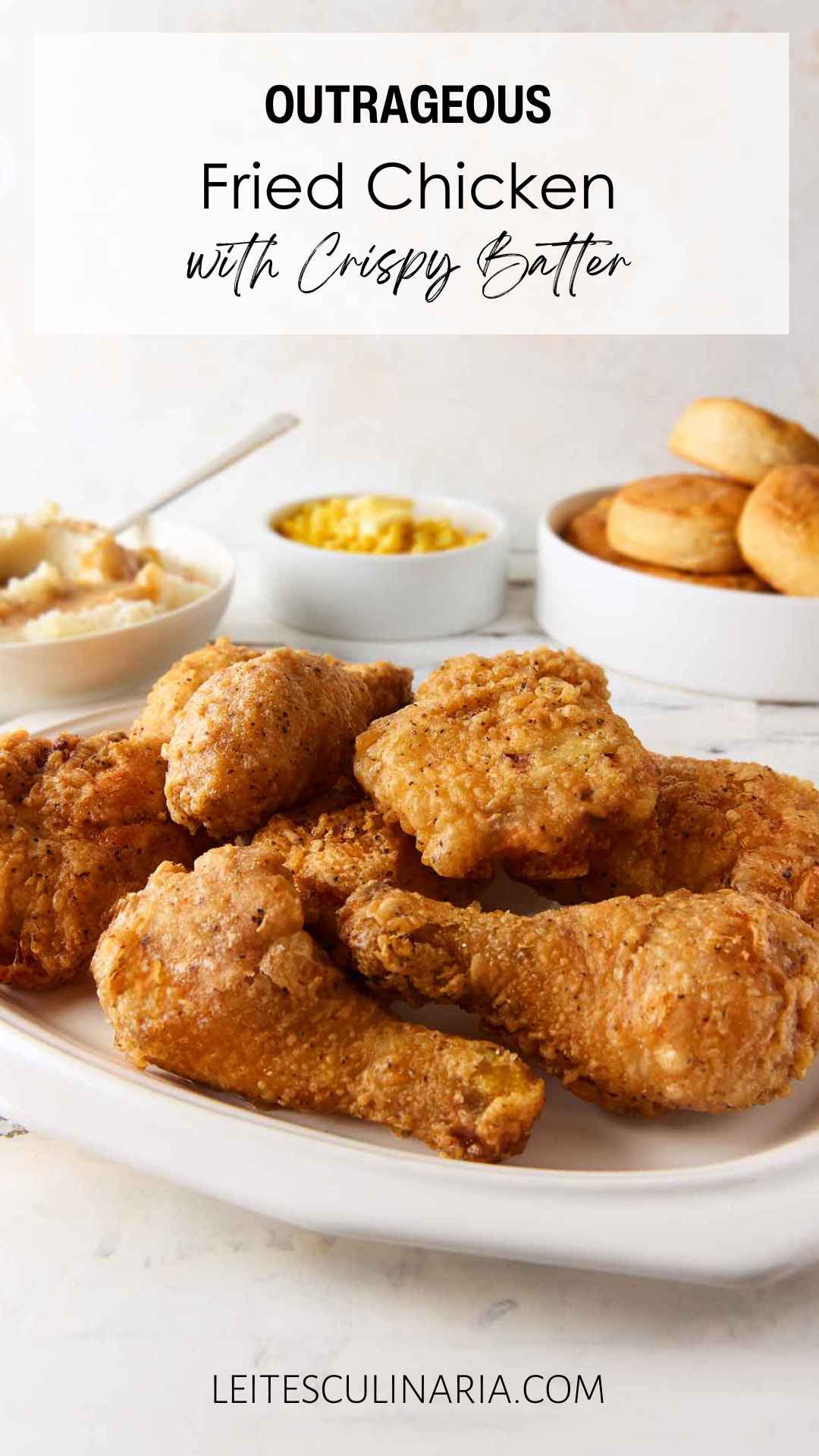 Pieces of batter-fried chicken piled on a white platter.