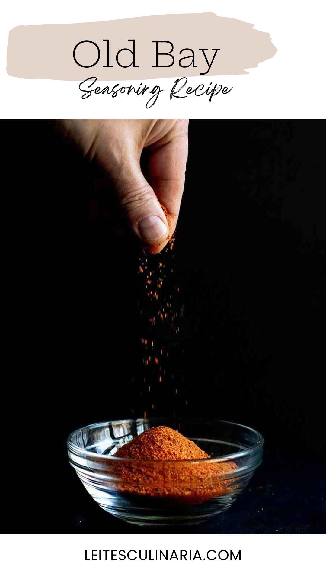 A person sprinkling seasoning into a glass bowl.