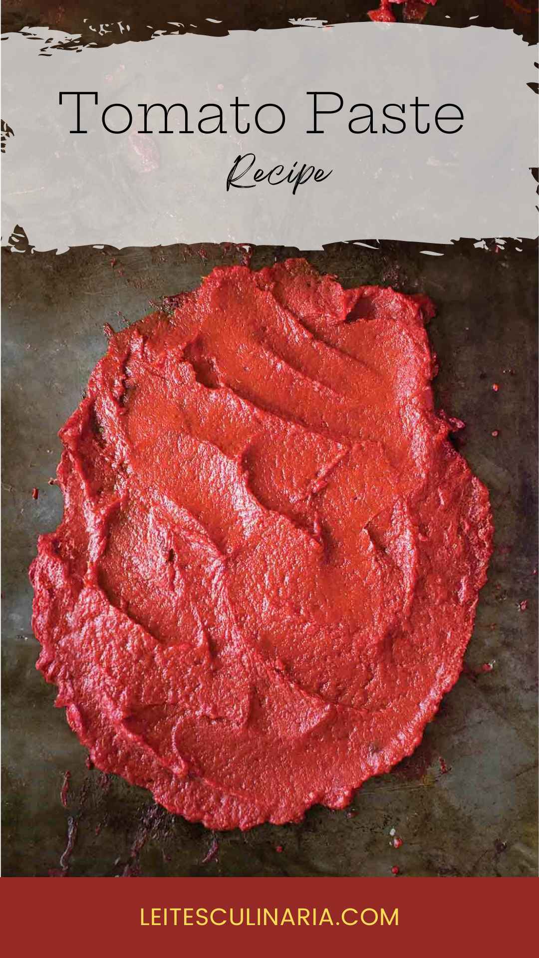 A thick layer of homemade tomato paste spread on a dark surface.