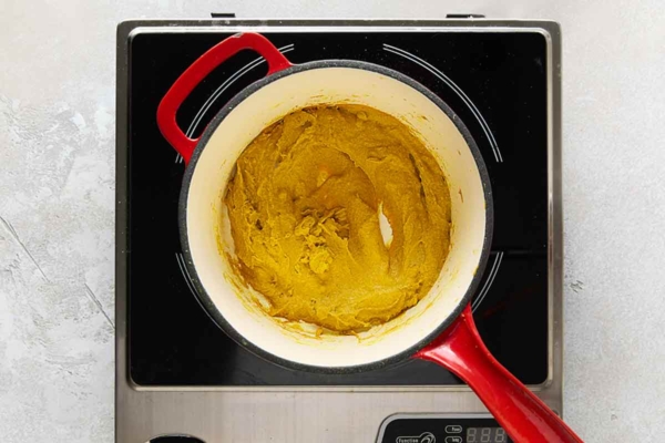 Cooked mustard paste in a small saucepan.