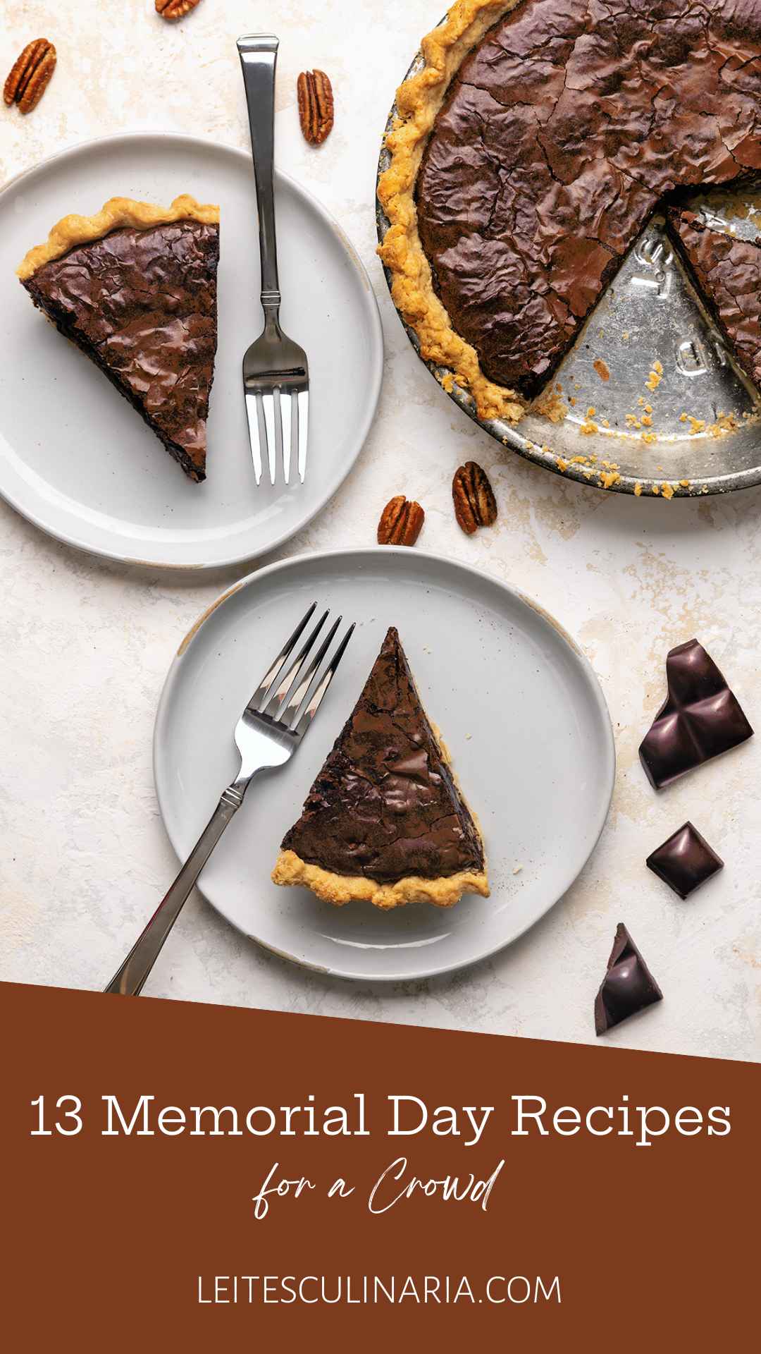A brownie pie with two slices cut from it on plates nearby.