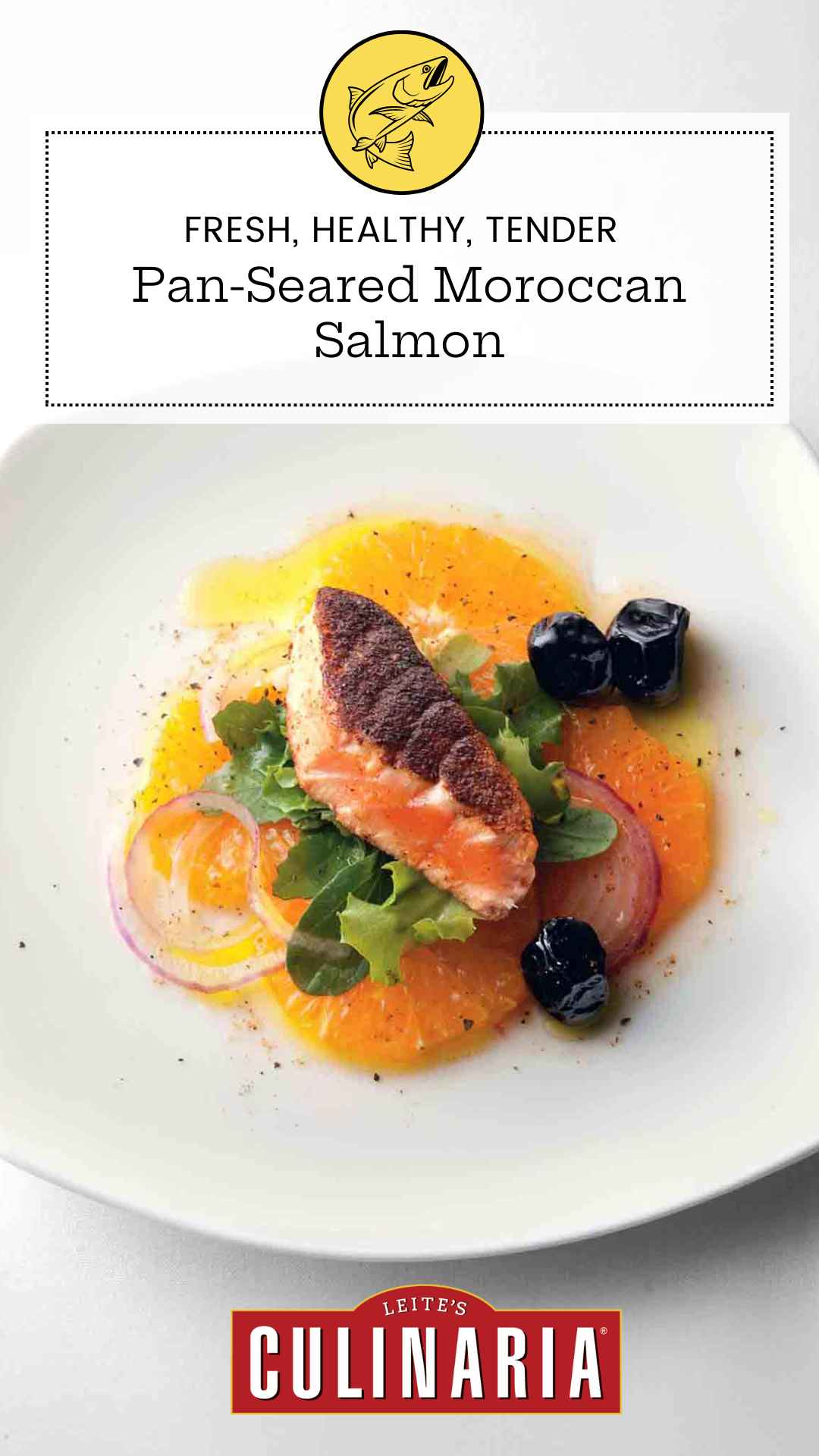 A piece of crispy salmon on top of sliced oranges, lettuce, black olives, and thinly sliced red onion on a white plate.