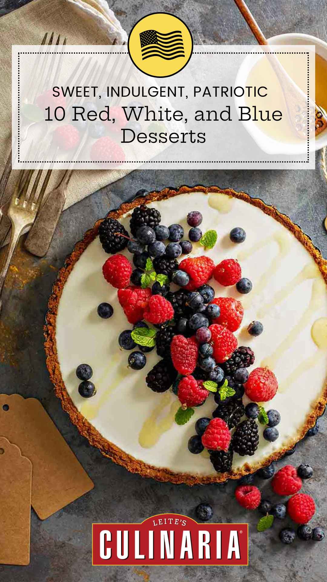 A tart topped with fresh berries and mint leaves.