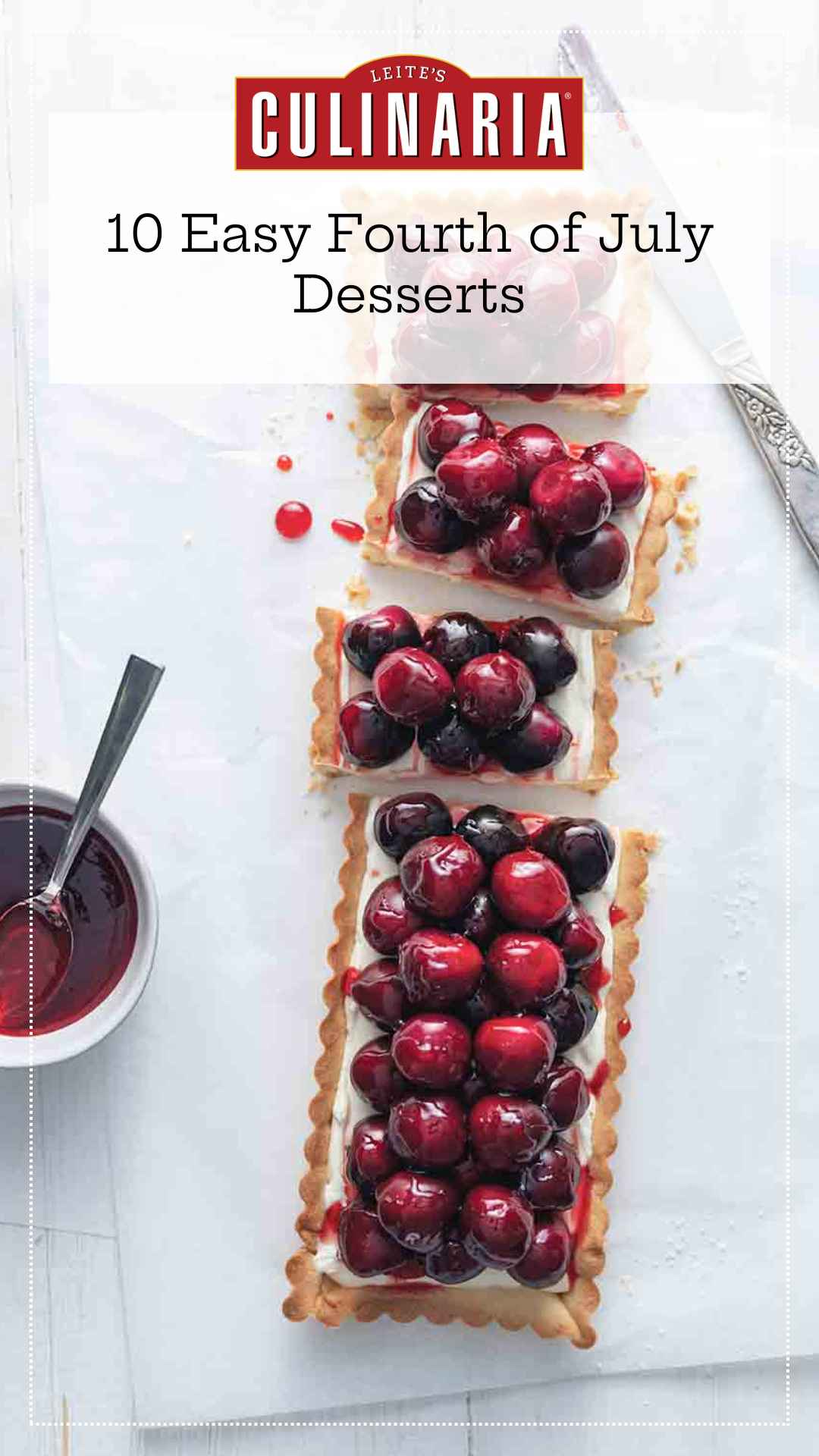 A fresh cherry tart cut into several pieces with a dish of cherry glaze on the side.
