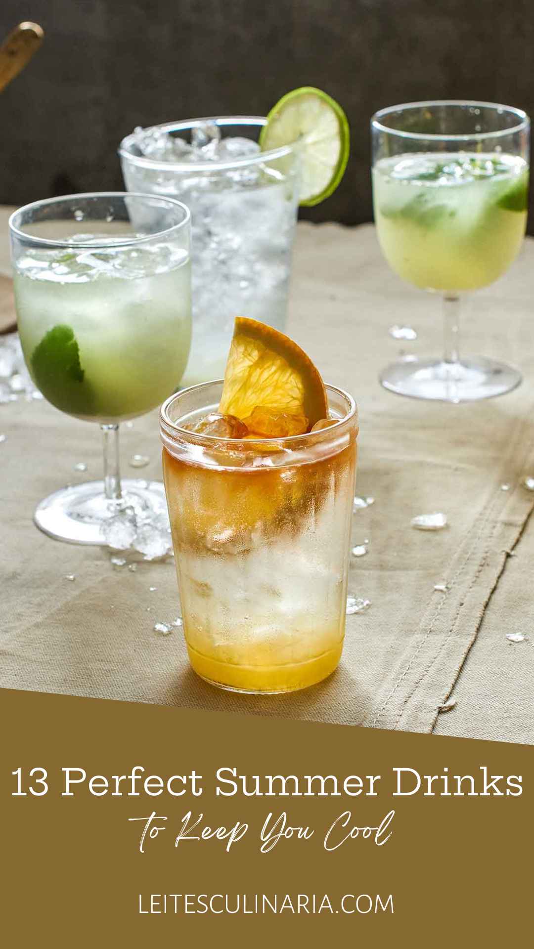 Several glasses of flavored soda garnished with orange and lime.