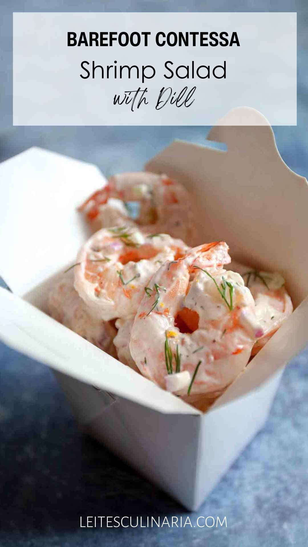 Creamy shrimp salad with fresh dill in a white takeout container.