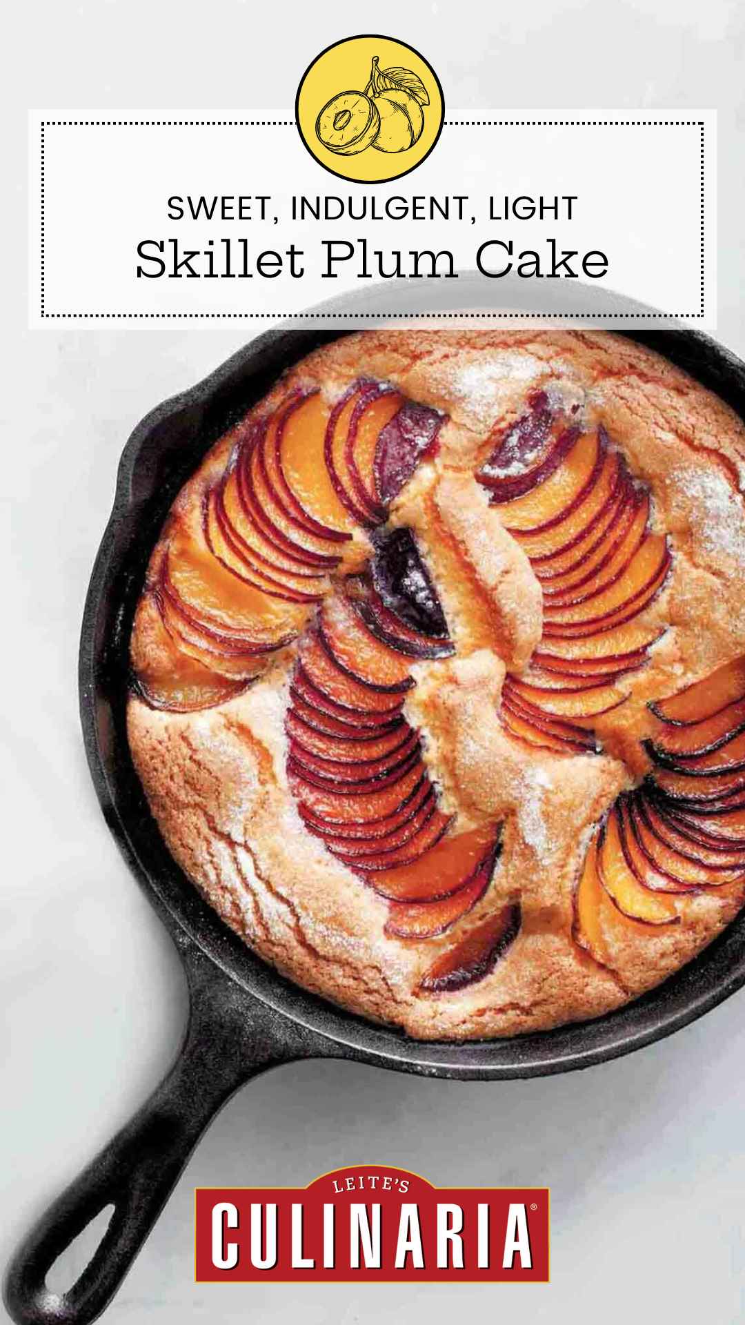 A cake in a cast iron skillet with sliced plums fanned across the surface and baked into the cake.