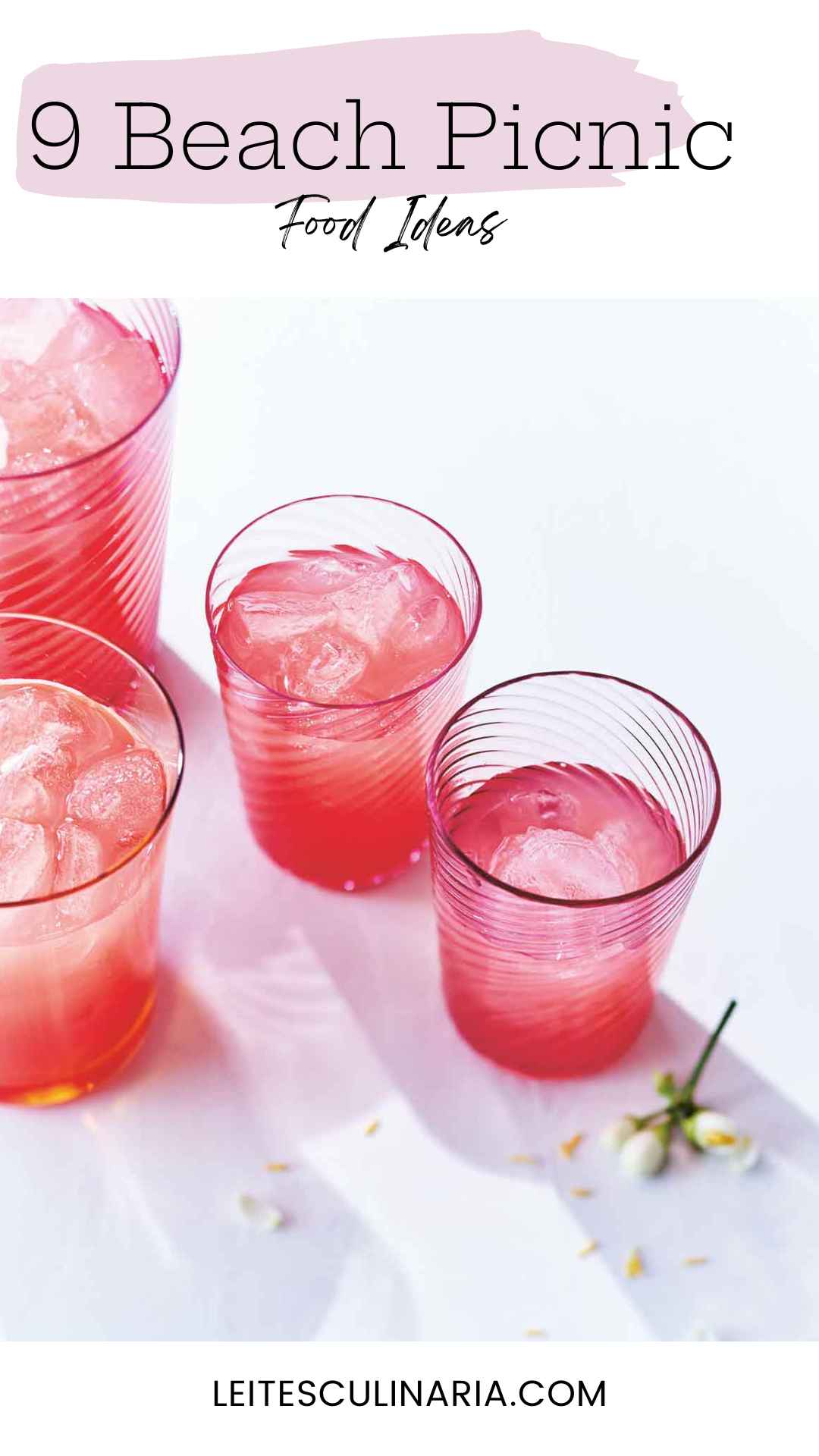 Several glasses of watermelon lemonade with ice cubes floating in them.