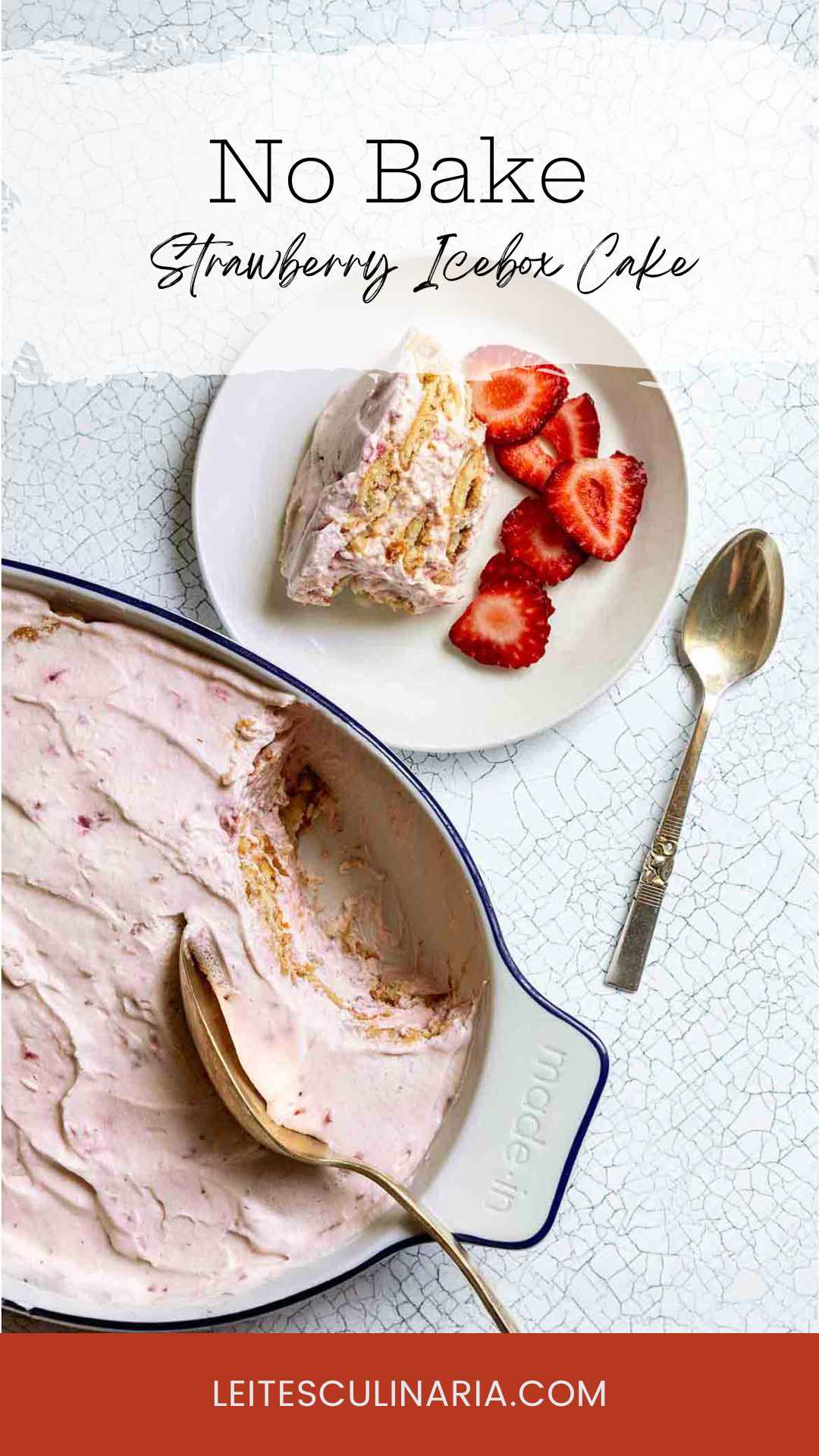 A oval dish filled with strawberry icebox cake with a serving on a plate next to it.