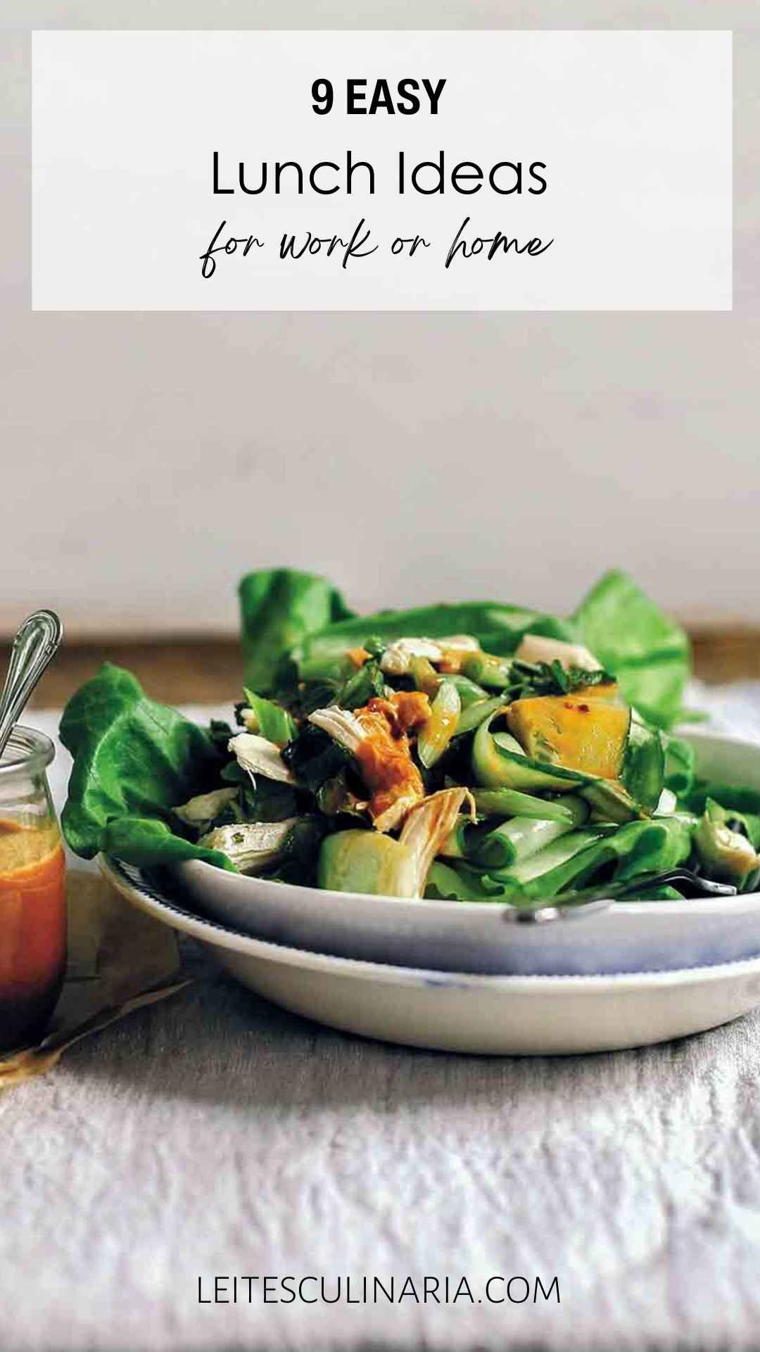 A bowl of chicken salad with a jar of dressing on the side.