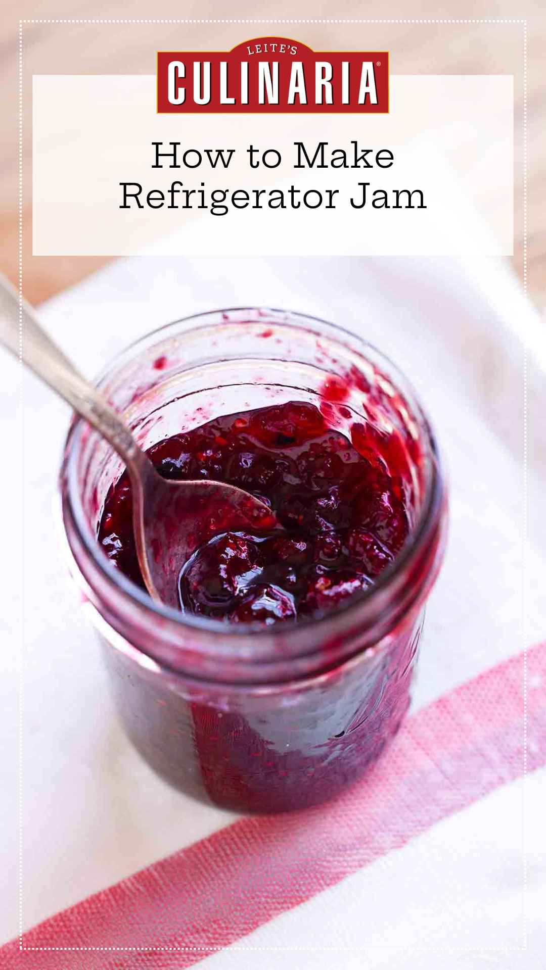 An open jar of homemade refrigerator jam with a spoon resting inside it.