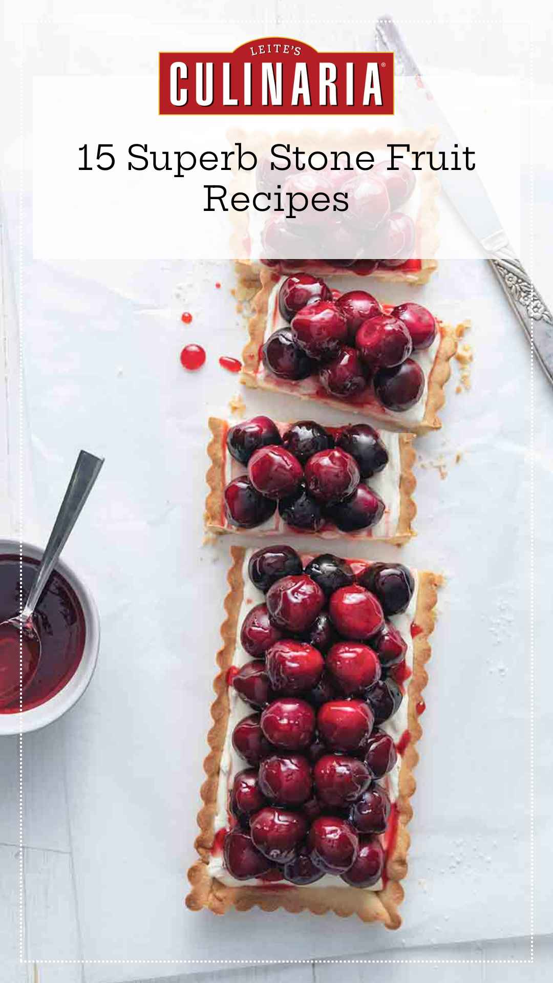 A rectangular fresh cherry tart cut into pieces.