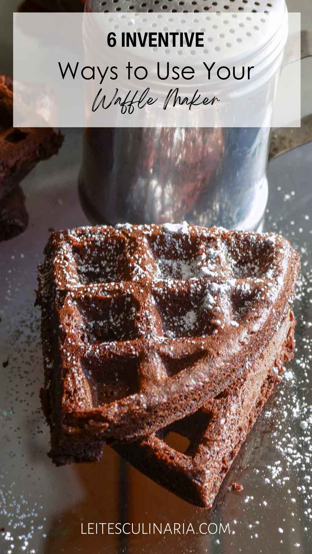 Two dark chocolate waffles dusted with confectioners' sugar.