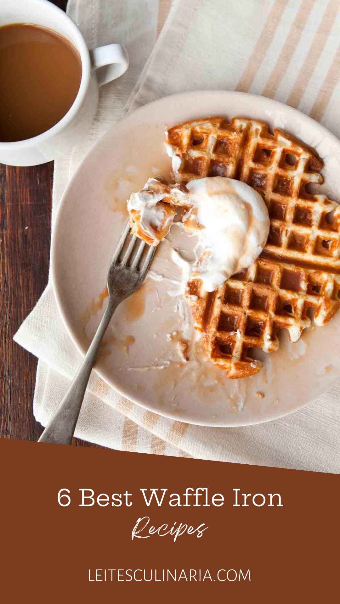 A partially eaten waffle topped with whipped cream and caramel sauce.