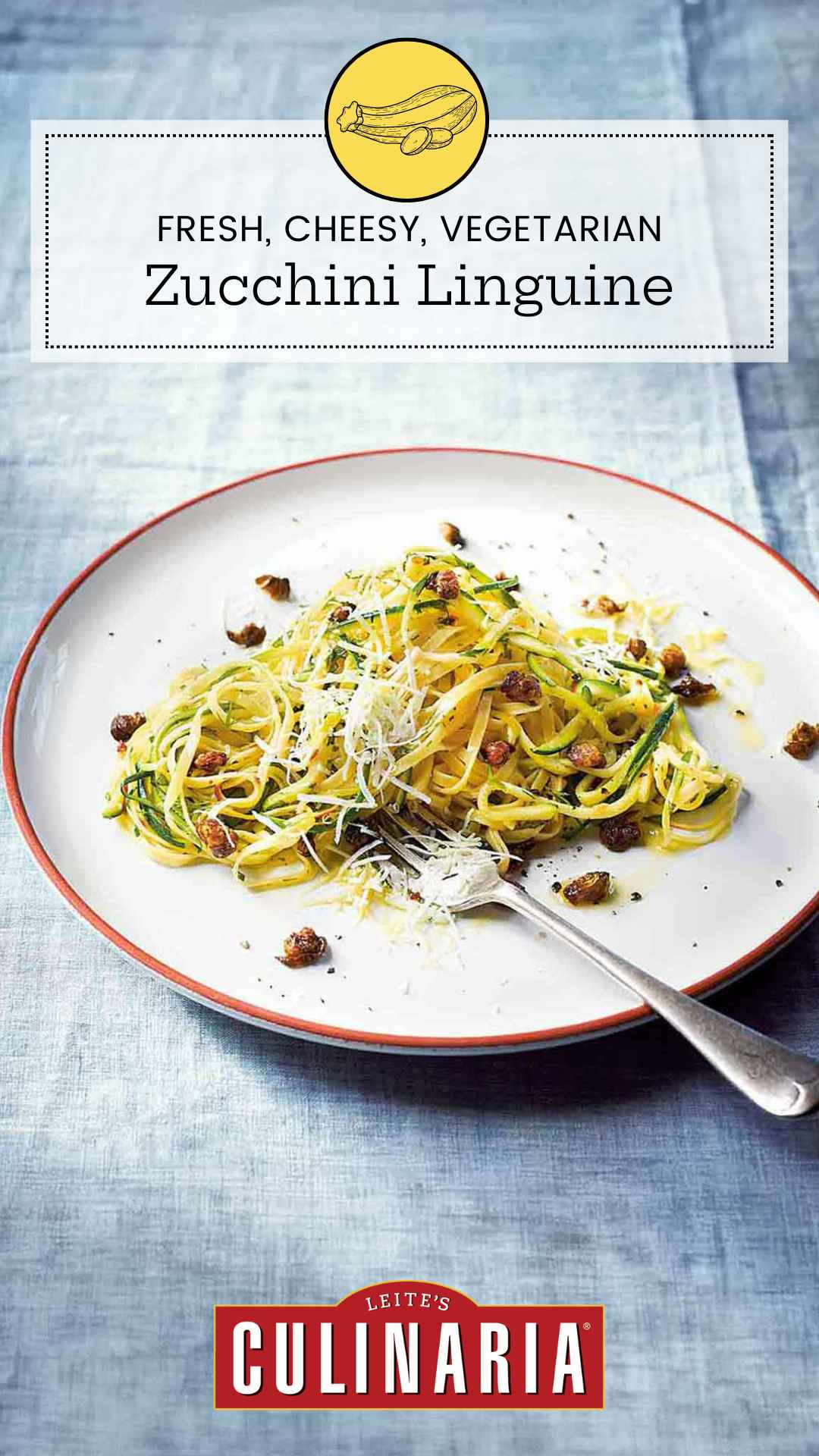 A serving of linguine and spiralized zucchini on a plate with capers and parmesan cheese.