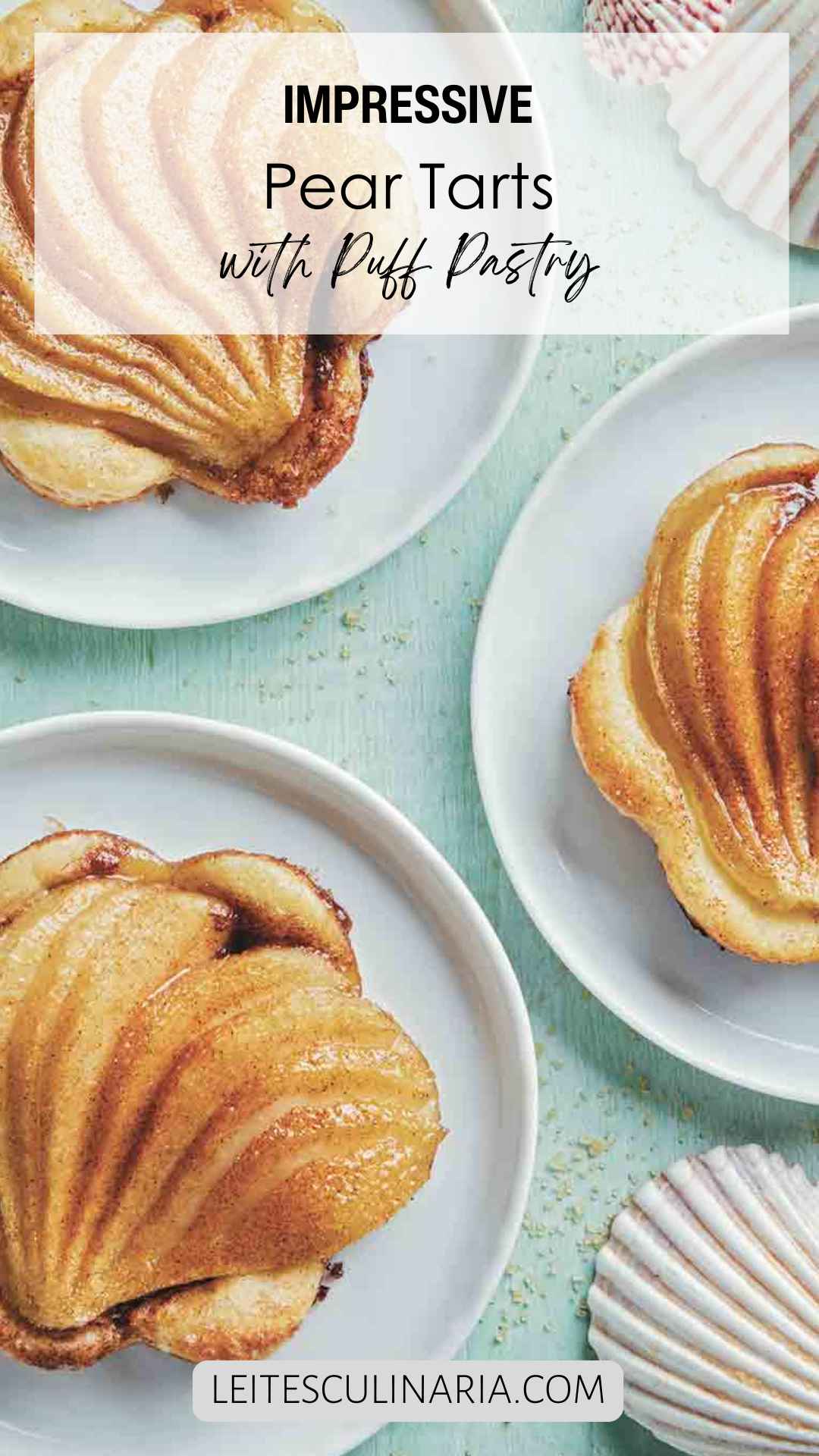 Three individual pear tarts with puff pastry on white plates.