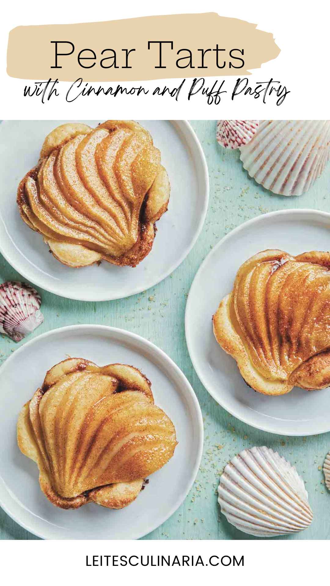 Three individual pear tarts with puff pastry on white plates.