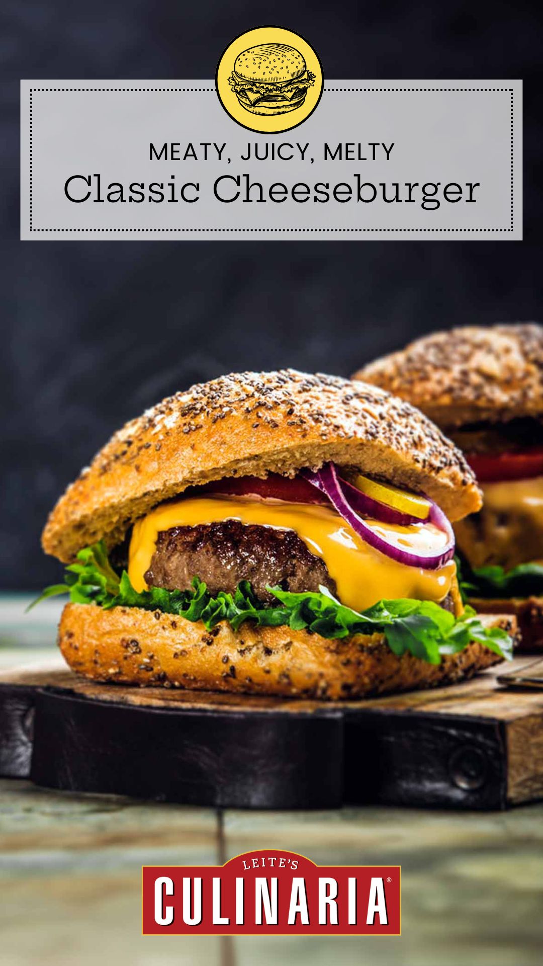 Two cheeseburgers with red onion, lettuce, and pickles on sesame buns on a wooden serving board.