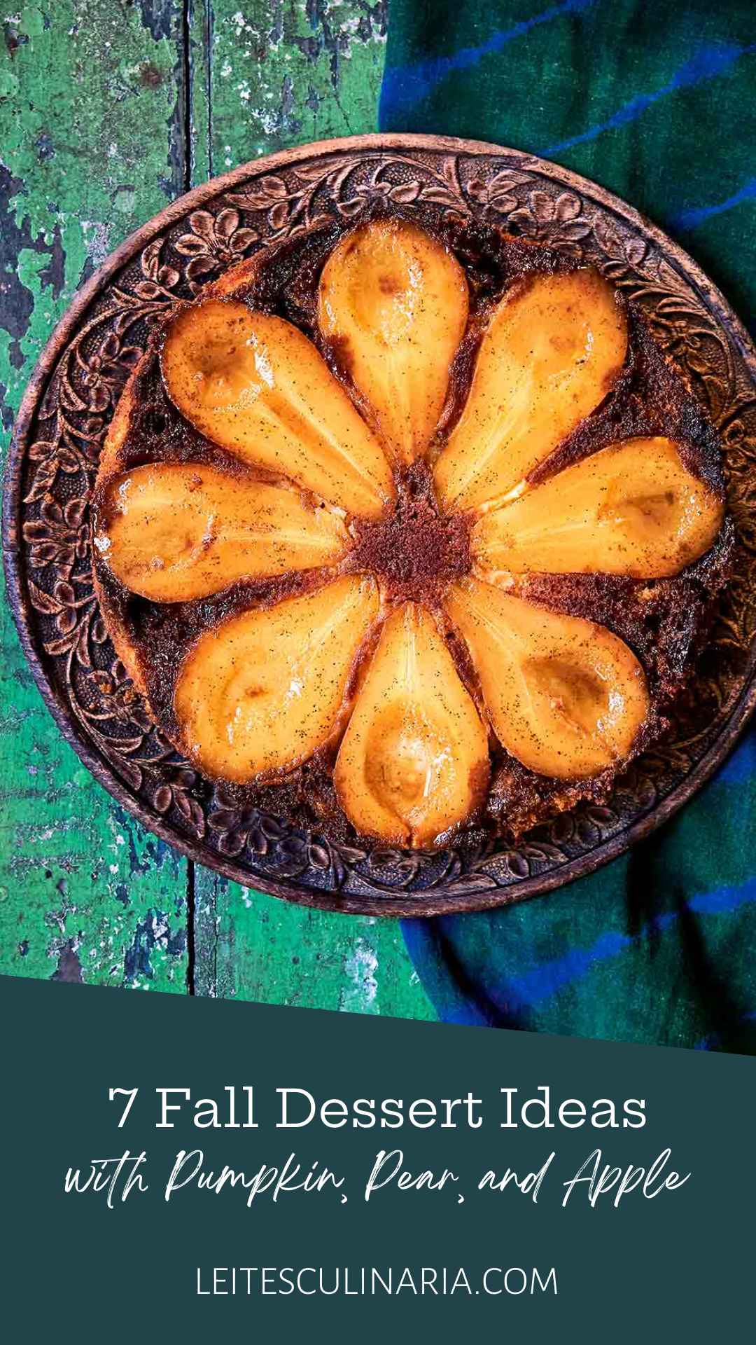 A pear upside-down cake on a decorative platter.