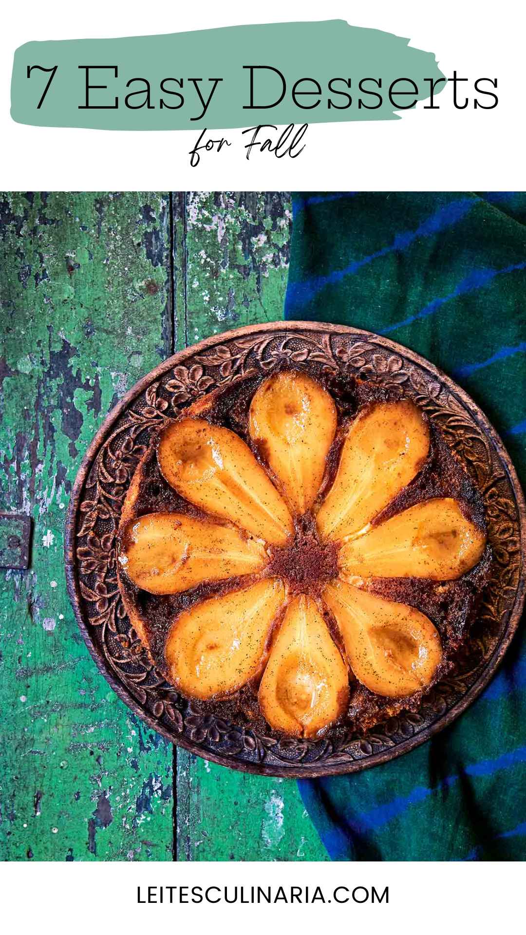 A pear upside-down cake on a decorative platter.