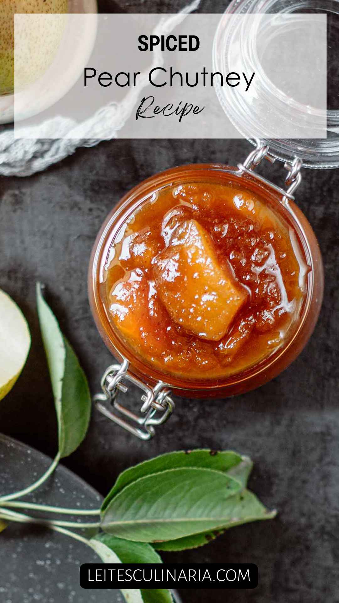 A glass jar filled with pear chutney.