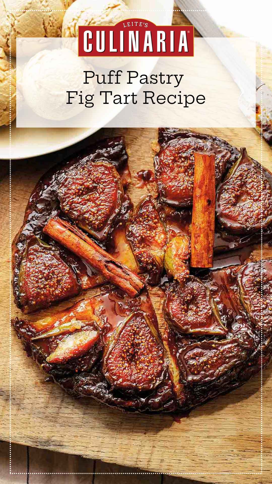 A whole fig tarte tatin topped with whole cinnamon sticks and cut into several pieces.